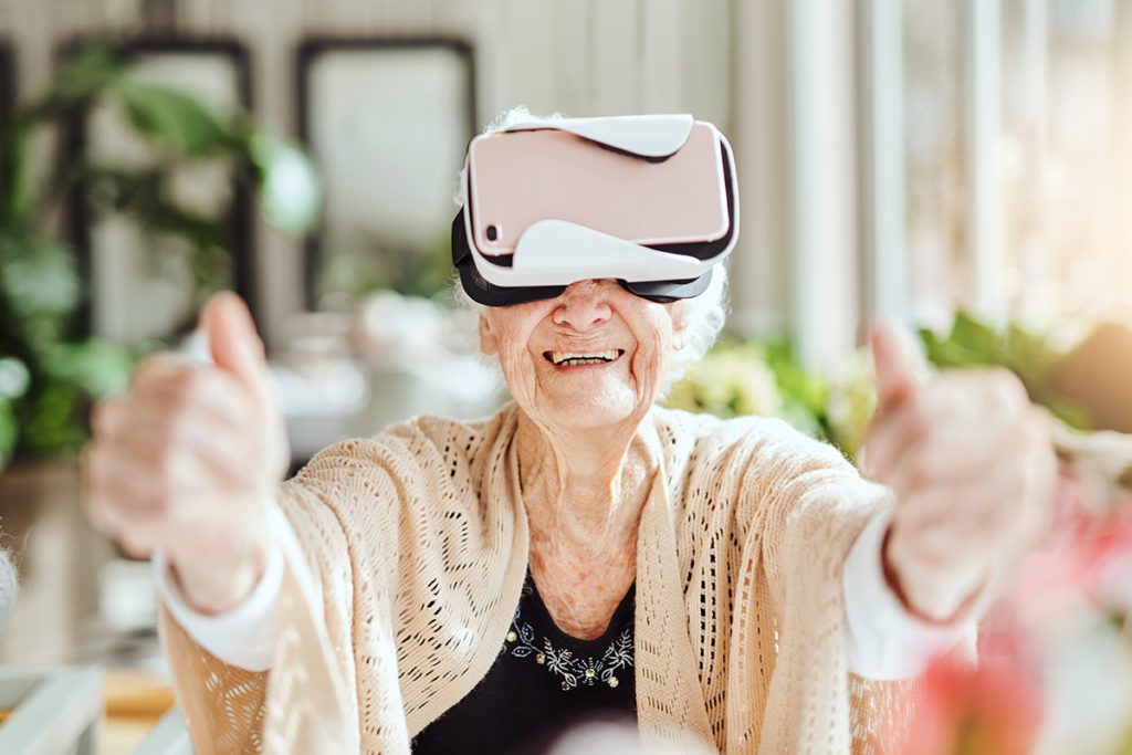 happy senior women using a virtual reality headset as part of telehealth