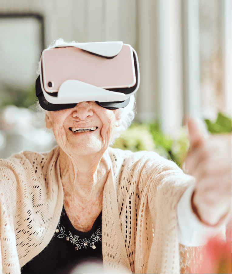 elderly women wearing virtual reality headset experiencing virtual therapy