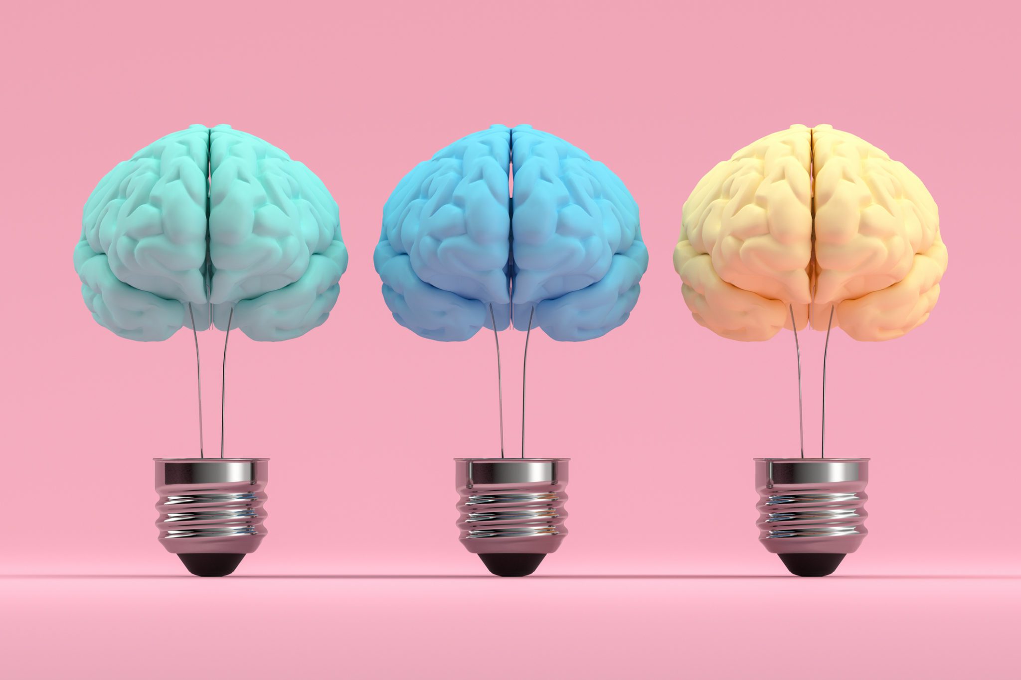 pink background with three different color brains inside light bulbs