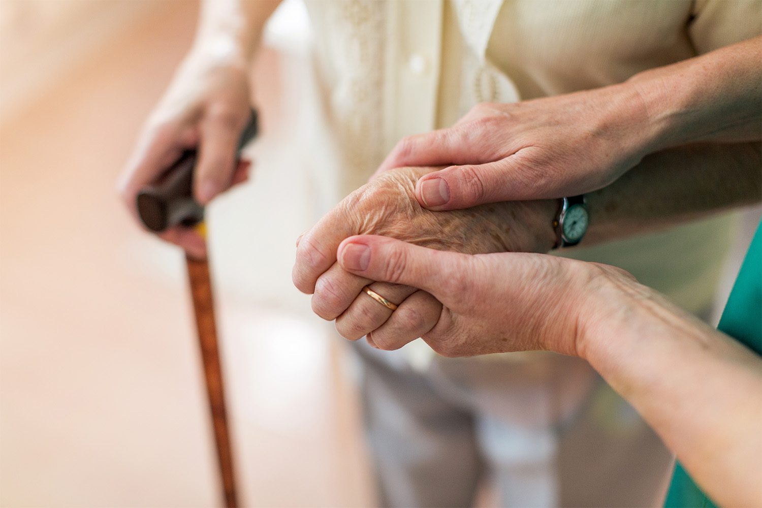 Nurse assisting an elderly patient with walking at a skilled nursing facility